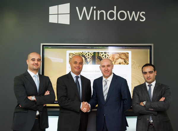 Left to right: From Microsoft, Mowafak Kowatly, account manager financial services, and Samer Abu Ltaif, regional general manager. From QFIB, Slim Bouker, chief operating officer, and Mahmood Shaker, chief information officer.